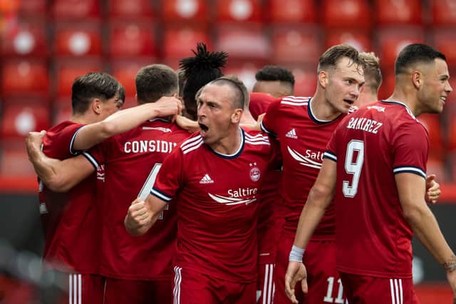 Aberdeen captain Scott Brown leads the celebrations against BK Hacken.