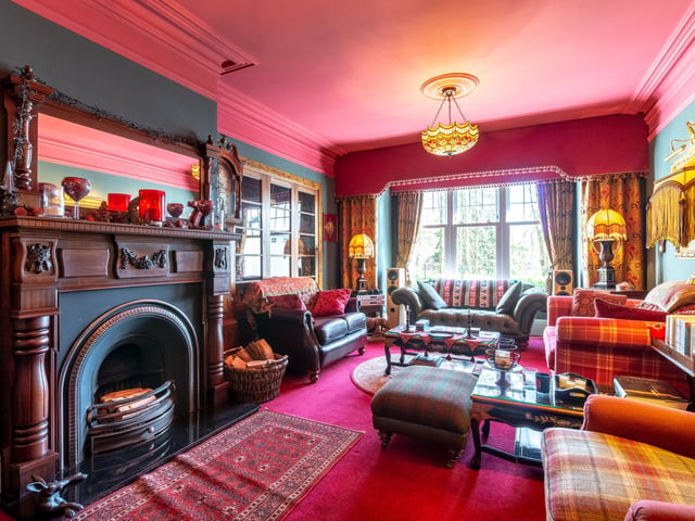 Interior: Two living rooms, family room, kitchen leading to dining room, study, conservatory, snug, and music room. Upstairs features a south-facing balcony, six bedrooms – three of them ensuite – and shower room.
