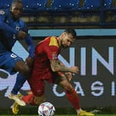 Finland's Glen Kamara (left) in action against Montenegro during this week's Nations League match. (Photo by SAVO PRELEVIC/AFP via Getty Images)