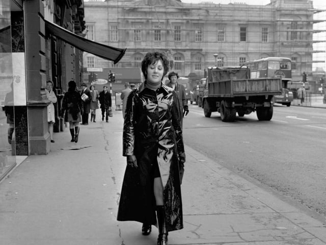 Model in PVC maxi coat, pic taken in North bridge Edinburgh, November 1969.