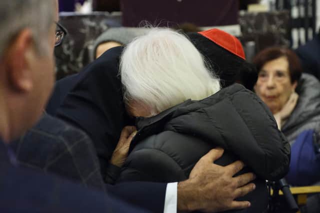 Humza Yousaf, and Mr Cowan's mother embracing during the service. Photo: Eloise Bishop/PA Wire
