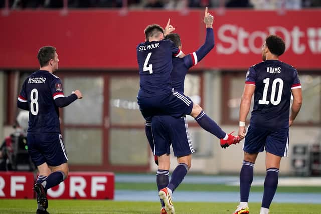 Scotland celebrate Dykes' goal.