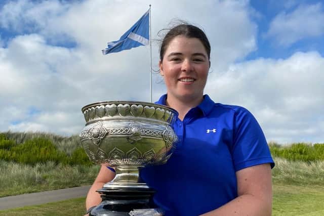Swiss-based Cameron Neilson shows off the trophy after winning the Scottish Women's Championship at Trump International Golf Links in Aberdeen. Picture: Scottish Golf.