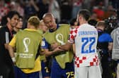 Croatia's Josip Juranovic consoles Japan forward, and Celtic team-mate, Daizen Maeda after the World Cup last 16 clash. (Photo by ANDREJ ISAKOVIC/AFP via Getty Images)