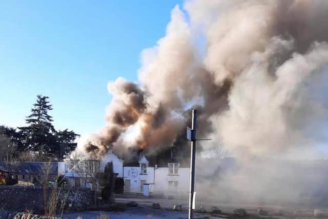 Smoke pictured billowing from the roof of the Old Mill Inn in Maryculter, Aberdeenshire picture: Fubar News