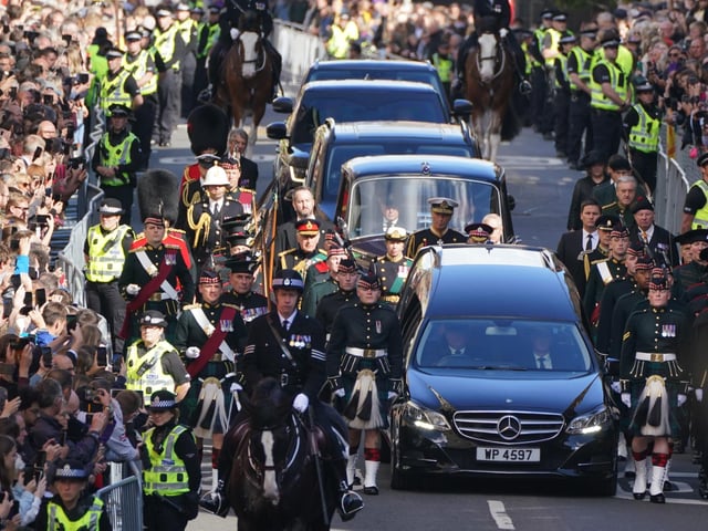 King Charles III and members of the royal family join the procession of Queen Elizabeth's coffin from the Palace of Holyroodhouse to St Giles' Cathedral, Edinburgh.Picture date: Monday September 12, 2022.