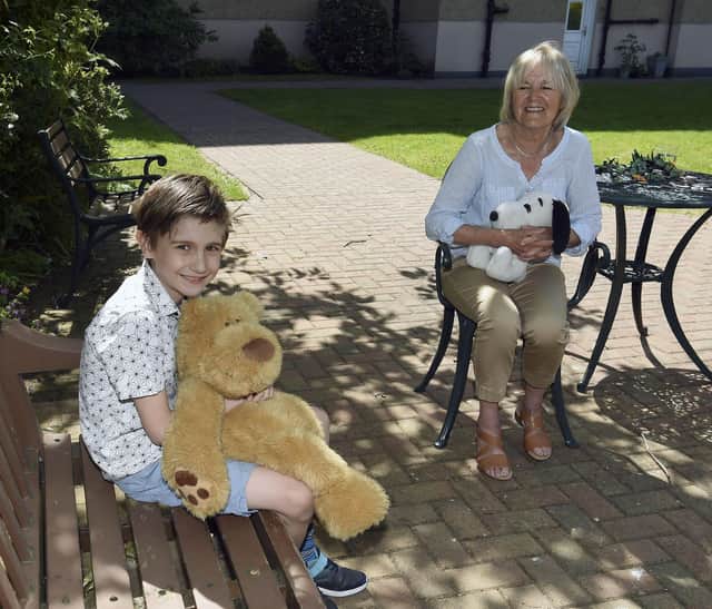 Rory Fisher, 8, with his grandmother Liz Fisher, 79, who is holding Snoopy