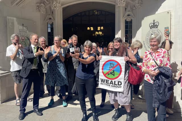 Environmental campaigner Sarah Finch  (centre) outside the Supreme Court in London after justices ruled that emissions generated from burning fuel should be considered when granting planning permission for oil sites.