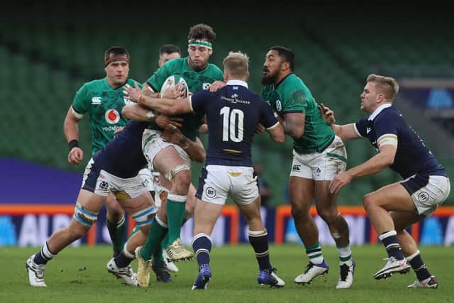 Scotland debutant Jaco van der Walt (No 10) tries to stop Caelan Doris of Ireland.