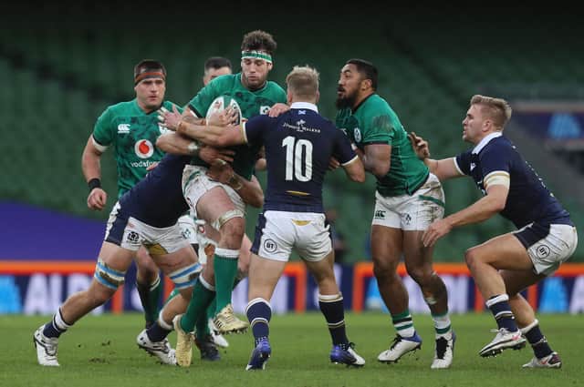 Scotland debutant Jaco van der Walt (No 10) tries to stop Caelan Doris of Ireland.