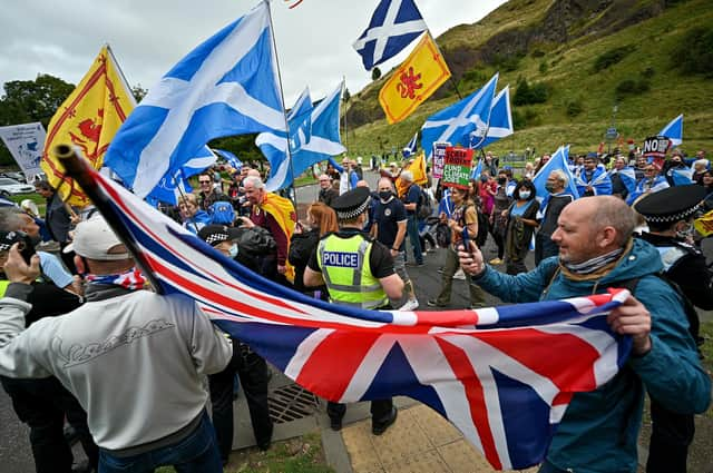 Unionist supporters confront Scottish pro-independence marchers