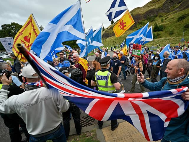 Unionist supporters confront Scottish pro-independence marchers