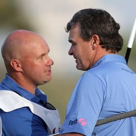 Paul Lawrie celebrates with Davy Kenny, who is now caddying for Grant Forrest, after the Aberdonian's win in the 2012 Commercialbank Qatar Masters at Doha Golf Club. Picture: Ross Kinnaird/Getty Images.