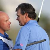 Paul Lawrie celebrates with Davy Kenny, who is now caddying for Grant Forrest, after the Aberdonian's win in the 2012 Commercialbank Qatar Masters at Doha Golf Club. Picture: Ross Kinnaird/Getty Images.