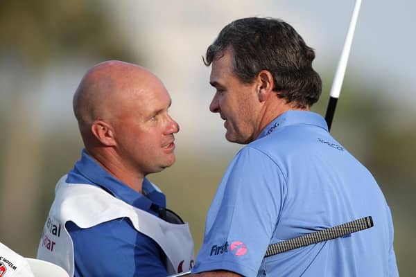 Paul Lawrie celebrates with Davy Kenny, who is now caddying for Grant Forrest, after the Aberdonian's win in the 2012 Commercialbank Qatar Masters at Doha Golf Club. Picture: Ross Kinnaird/Getty Images.