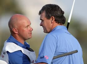 Paul Lawrie celebrates with Davy Kenny, who is now caddying for Grant Forrest, after the Aberdonian's win in the 2012 Commercialbank Qatar Masters at Doha Golf Club. Picture: Ross Kinnaird/Getty Images.