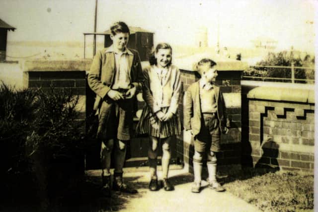 John Lennon aged 7 (right), with cousins Leila, 10, and Stan Parkes, aged 14, on holiday in Fleetwood in 1948.