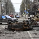 A part of a destroyed tank and a burned vehicle sit in an area controlled by Russian-backed separatist forces in Mariupol, Ukraine. (AP Photo/Alexei Alexandrov)