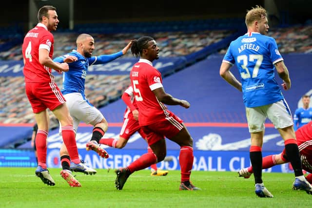 Kemar Roofe scores Rangers' second goal in their 4-0 win against Aberdeen in the Premiership at Ibrox on Sunday. (Photo by Mark Runnacles/Getty Images)