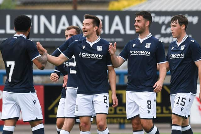 MONTROSE, SCOTLAND - JULY 05: Dundee's Cammy Kerr congratulates Alex Jakubiak on his goal against Montrose.