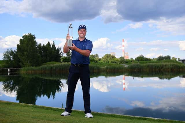 Marc Warren with the trophy after winning the Austrian Open at Diamond Country Club last July. Picture: Stuart Franklin/Getty Images.