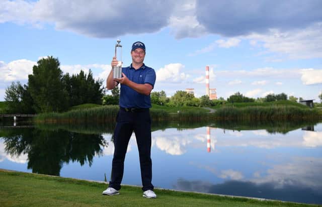 Marc Warren with the trophy after winning the Austrian Open at Diamond Country Club last July. Picture: Stuart Franklin/Getty Images.
