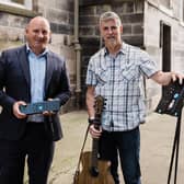 From left: Brian Machray, business development director at Reward Finance Group, with Noisy Clan founder David Law and his Wee Stand product. Picture: Daniel Rannoch/Fern Photography.