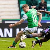 Hibs' Chris Cadden and St Johnstone's Adama Sidibeh tussle for possession at Easter Road.