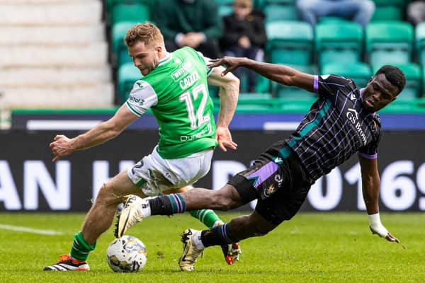 Hibs' Chris Cadden and St Johnstone's Adama Sidibeh tussle for possession at Easter Road.