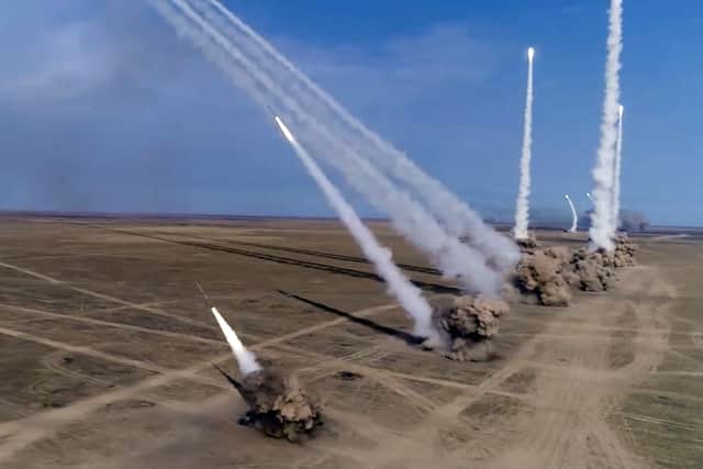 File distributed by Russian Defense Ministry Press Service on Sept. 26, 2020, Russian rockets launch from missile systems during the main stage of the Kavkaz-2020 strategic command-and-staff exercises at the Kapustin Yar training ground, Russia. AP