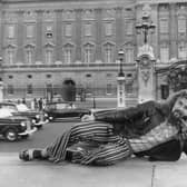 Billy Connolly in front of Buckingham Palace during a visit to London in July 1974.