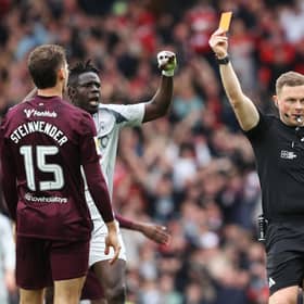 Hearts defender Michael Steinwender is shown a straight red card by referee John Beaton during the Scottish Cup semi-final defeat to Aberdeen at Hampden. (Photo by Alan Harvey / SNS Group)