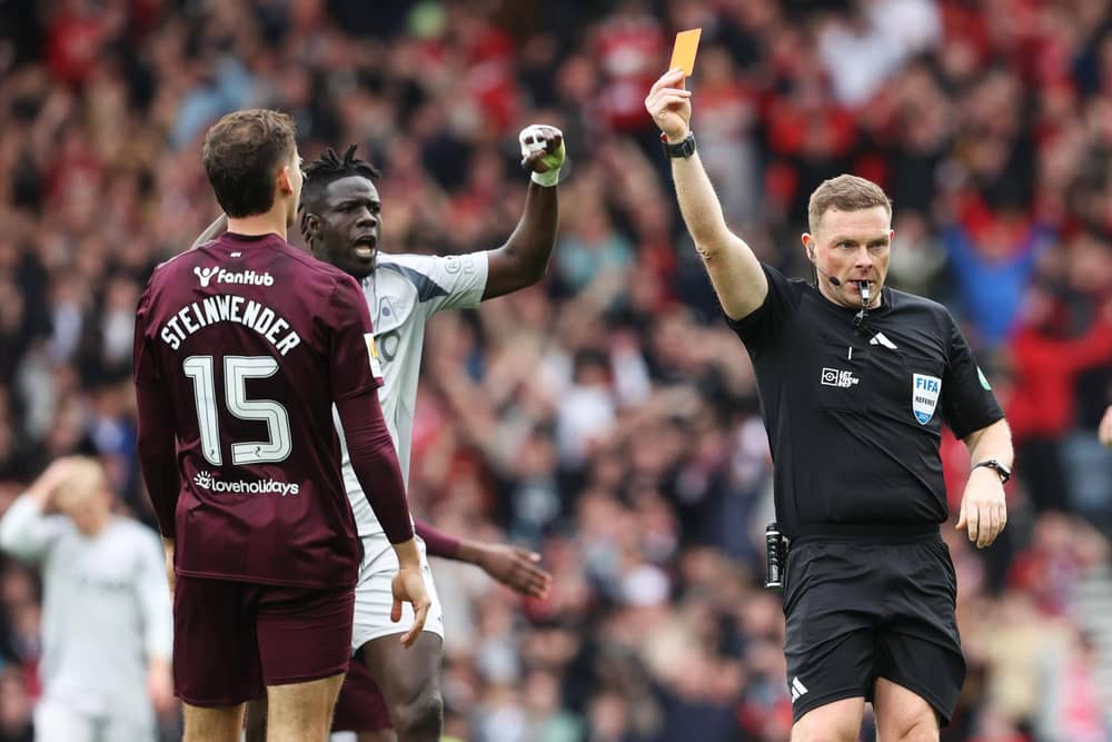 Hearts defender Michael Steinwender is shown a straight red card by referee John Beaton during the Scottish Cup semi-final defeat to Aberdeen at Hampden. (Photo by Alan Harvey / SNS Group)