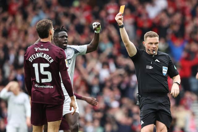 Hearts defender Michael Steinwender is shown a straight red card by referee John Beaton during the Scottish Cup semi-final defeat to Aberdeen at Hampden. (Photo by Alan Harvey / SNS Group)