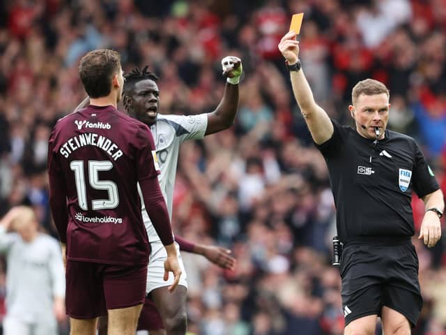 Hearts defender Michael Steinwender is shown a straight red card by referee John Beaton during the Scottish Cup semi-final defeat to Aberdeen at Hampden. (Photo by Alan Harvey / SNS Group)