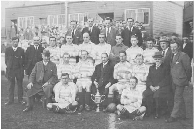 Greenock Morton players pictured with the Scottish Cup after beating Rangers in the 1922 final at Hampden.