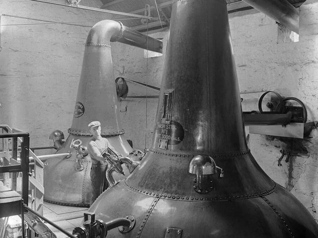 Still houses in at the Glenlivett Distillery, in Elgin, in June 1959.
