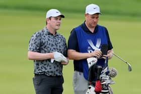 Bob MacIntyre and caddie Mike Burrow prepare to play a shot on the first hole during the third round of the 106th PGA Championship at Valhalla Golf Club in Louisville, Kentucky. Picture: Andy Lyons/Getty Images.