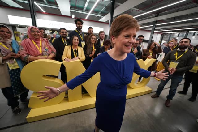 First Minister Nicola Sturgeon poses for a photograph with delegates during a visit to the exhibitors hall at the SNP conference at The Event Complex Aberdeen (TECA) in Aberdeen , Scotland.