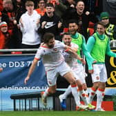 Charlie Mulgrew celebrates after scoring to make it 2-1.