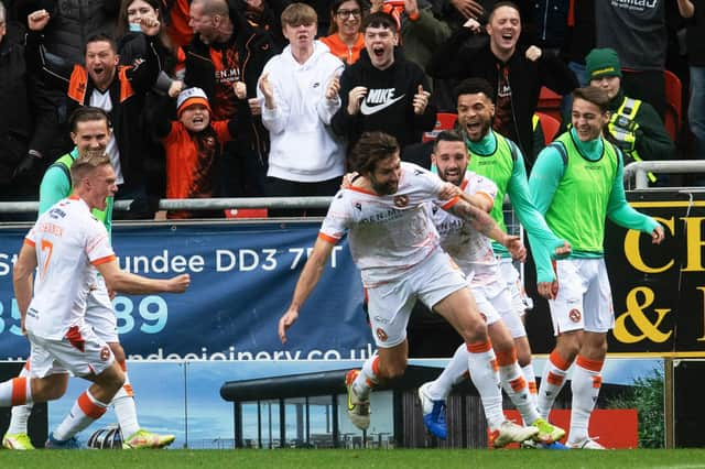 Charlie Mulgrew celebrates after scoring to make it 2-1.