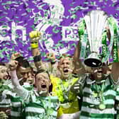 Celtic’s Tom Rogic lifts the the cinch Premiership trophy after the 6-0 win over Motherwell.