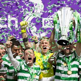Celtic’s Tom Rogic lifts the the cinch Premiership trophy after the 6-0 win over Motherwell.