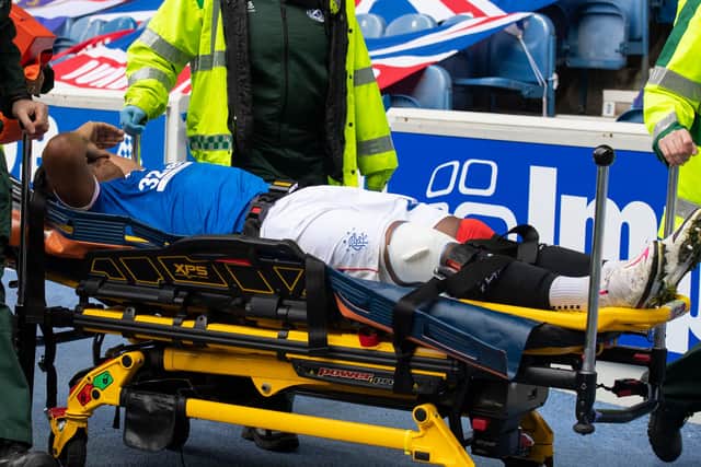 Alfredo Morelos who was carried off on a stretcher with a badly cut knee.