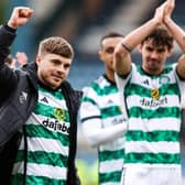 James Forrest takes the acclaim of the Celtic fans after his match-winning double against Dundee at Dens Park.  (Photo by Ross Parker / SNS Group)