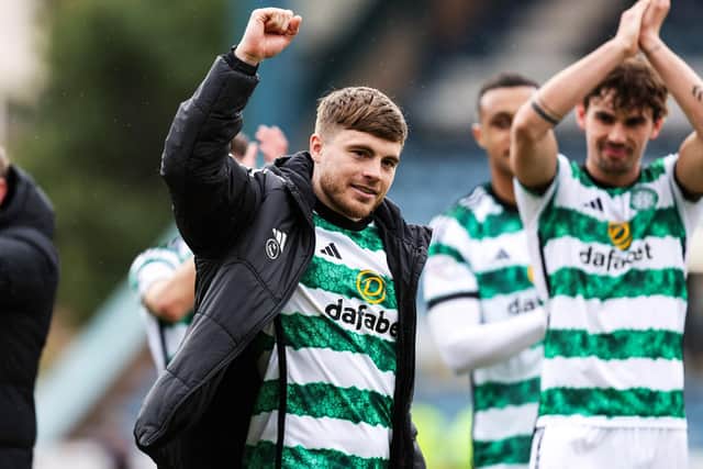 James Forrest takes the acclaim of the Celtic fans after his match-winning double against Dundee at Dens Park. (Photo by Ross Parker / SNS Group)