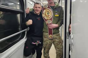 Andrew Harrold, with Ukrainian championship boxer, Denys Berincyk.