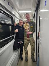Andrew Harrold, with Ukrainian championship boxer, Denys Berincyk.