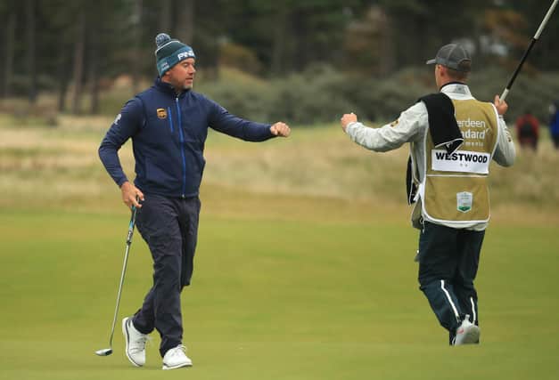 Leader Lee Westwood fist pumps his son and caddie Sam on the 18th green after his first round of the Aberdeen Standard Investments Scottish Open at The Renaissance Club. Picture: Andrew Redington/Getty Images