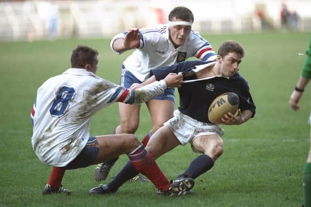 Redpath in typically tenacious action against France in 1995, the year Scotland laid a 26-year hoodoo to rest